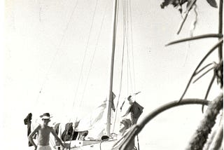 A 15-year-old boy and his 20-foot sailboat on a beach in the Florida Keys.