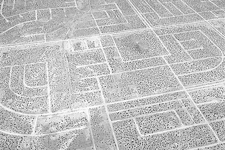 A black and white photograph of a desolate housing development from Noritaka Minami’s California City, California series.