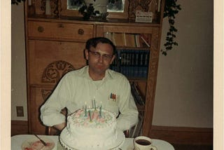 My dad on his 40th birthday cutting his cake