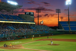 A sunset view of a baseball stadium.