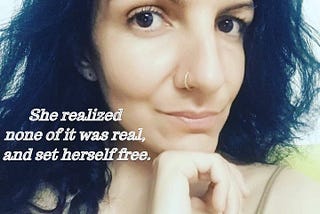 Portrait of a woman with black hair, black eyes, golden nose ring, one hand under her chin and the words “She realized none of it was real and set herself free” written in the bottom left side of the image