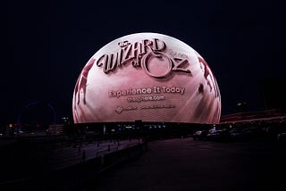 The Sphere in Las Vegas, NV with a black and white image, displaying the title card for The Wizard of Oz Sphere Experience