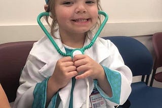 Photo of my then five-year-old daughter dressed as a doctor.