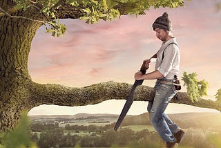 A person using a saw to cut off the tree branch they are sitting on.