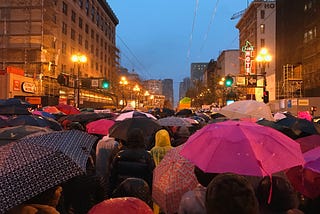 People marching for women’s rights, following the election of Donald Trump, in San Francisco. It’s a dark, rainy day yet the large crowd blanketed in umbrellas and raincoats will not be denied.