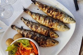 A plate of grilled sardines