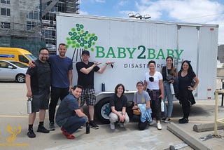 A group of Xpedition employees gathered at a volunteer event at Baby2Baby