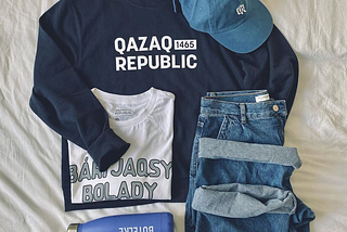 Long-sleeve, t-shirt, baseball cap, and water bottle from the Qazaq Republic brand.