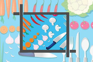 Vegetables and silverware organized on a table top and shown inside a cropped view as if in a layout by a graphic designer
