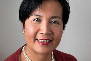 Portrait of Helen Huang, Australian author known for her debut political thriller novel ‘Nuclear Power Nuclear Game.’ Helen is depicted with a thoughtful expression, symbolizing her deep engagement with complex themes in her writing. She is recognized for her unique storytelling and significant contributions to the political thriller genre as a female author.
