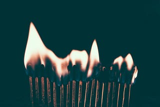Matchsticks in a line, burning