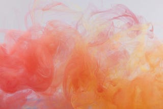 Pink and peach colour immersed in water