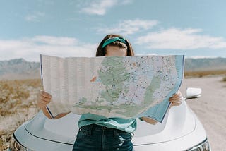 woman reading a map