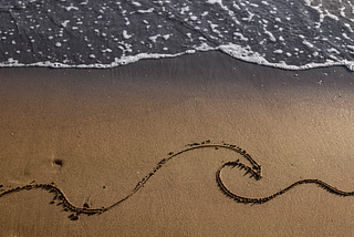 View of beach sand in summertime with line.