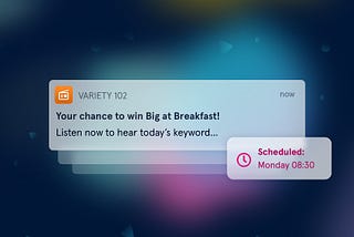 An illustration of an example push notification which reads “Variety 102. Your chance to win Big at Breakfast! Listen now to hear today’s keyword…”. Next to it is a bubble containing “Scheduled: Monday 08:30” with a clock icon.