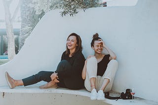 Woman and daughter laughing