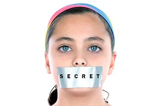 Girl with duct tape on her mouth. The tape has the word secret on it.