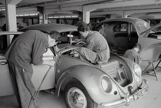 Workers on a VW Beetle. 1957