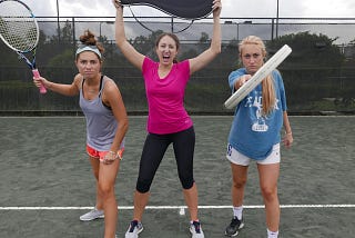 Three Women Holding Tennis Rackets