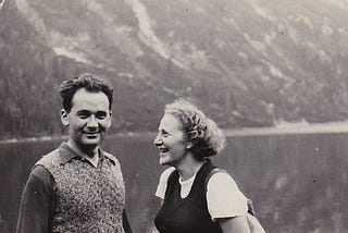 A young couple hiking in the Polish mountains poses beside lake in 1939.