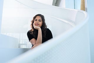 Woman sitting on staircase