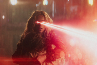supergirl with red laser eyes