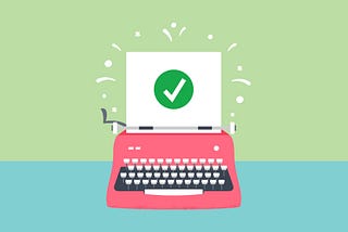 A typewriter with a green check mark on paper