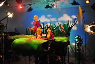 Turtle and Ladybug puppets on a puppet stage