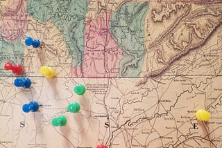 Civil War era railroad map on the TN/KY border hanging on my wall. Blues and green tacks are branches of the family on either side of the Cumberland Plateau. Red and yellow are places of significant events. Photo by author.