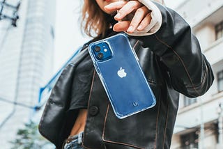 Image of an iphone being dropped by attractive female.