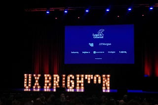 View of the UX Brighton 2022 stage with the lights down, taken from the audience