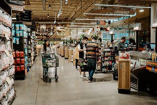 Consumers shopping in a grocery store