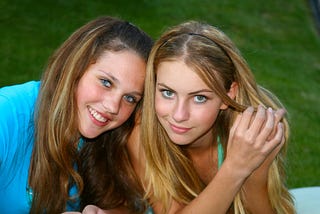 Teen girls with attitude, looking at the camera and smiling