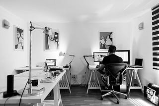 A person sits at a desk working from home.