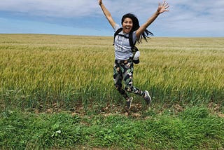 Woman jumping in a field