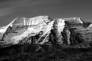 Black and White panorama of a jagged mountain range.