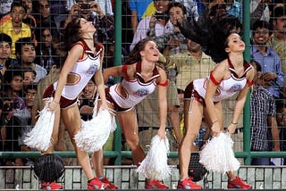 What are skimpily clad women cheerleaders doing in a cricket stadium?