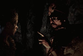 Senua learns some lore from live action FMV man Druth in Hellblade.