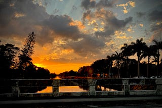 Photo taken by author’s friend that inspired this story of a sunset over a canal in Miami