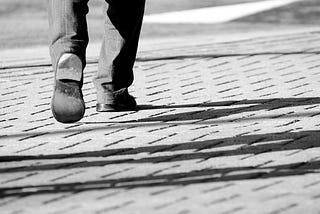A man walking step by step.