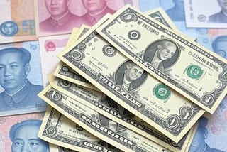 US dollar bills with Chinese yuan and other currencies in the background, showing global currency competition