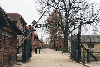 Gate to Auschwitz I with its Arbeit macht frei sign (“work sets you free”)