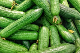 A pile of green courgettes.