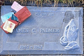 gravestone which reads my son Jim — with wallet, contents,