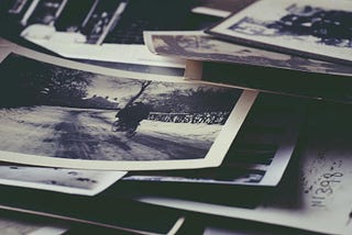 A pile of old, black-and-white photos.