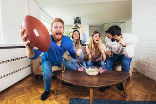 Friends watching football on TV
