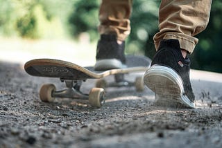 Close up of someone standing on a skateboard