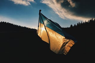 Photo of Ukrainian flag blowing in the wind, by Max Kukurudziak