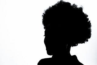 silhoutte of a black woman with an afro