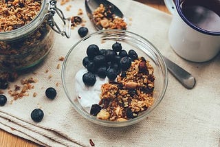 Easy and healthy granola in a mug with yogurt. Microwave